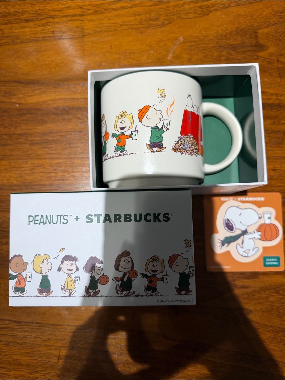 Peanuts + Starbucks Ceramic mug and empty snoopy gift card